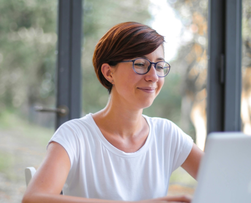 Lady with glasses using a computer